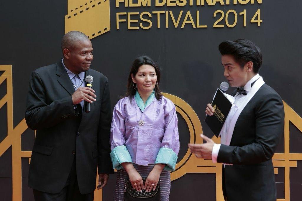 Karma Deki at the Thailand Film Destination Festival 2014 on stage with presenters